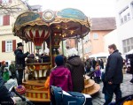 A small carousel - love the guy's hat!