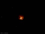 Closeup of a floating lantern, taken from far away