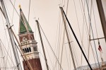 Top of the St. Mark's Bell Tower behind the boat masts