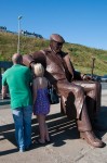 Visitors to the Freddie Gilroy statue