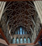 Ceiling stretching down the length of the area between those two windows