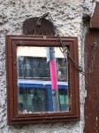 Mirror and Comb (closeup), on the wall on a street in Tübingen